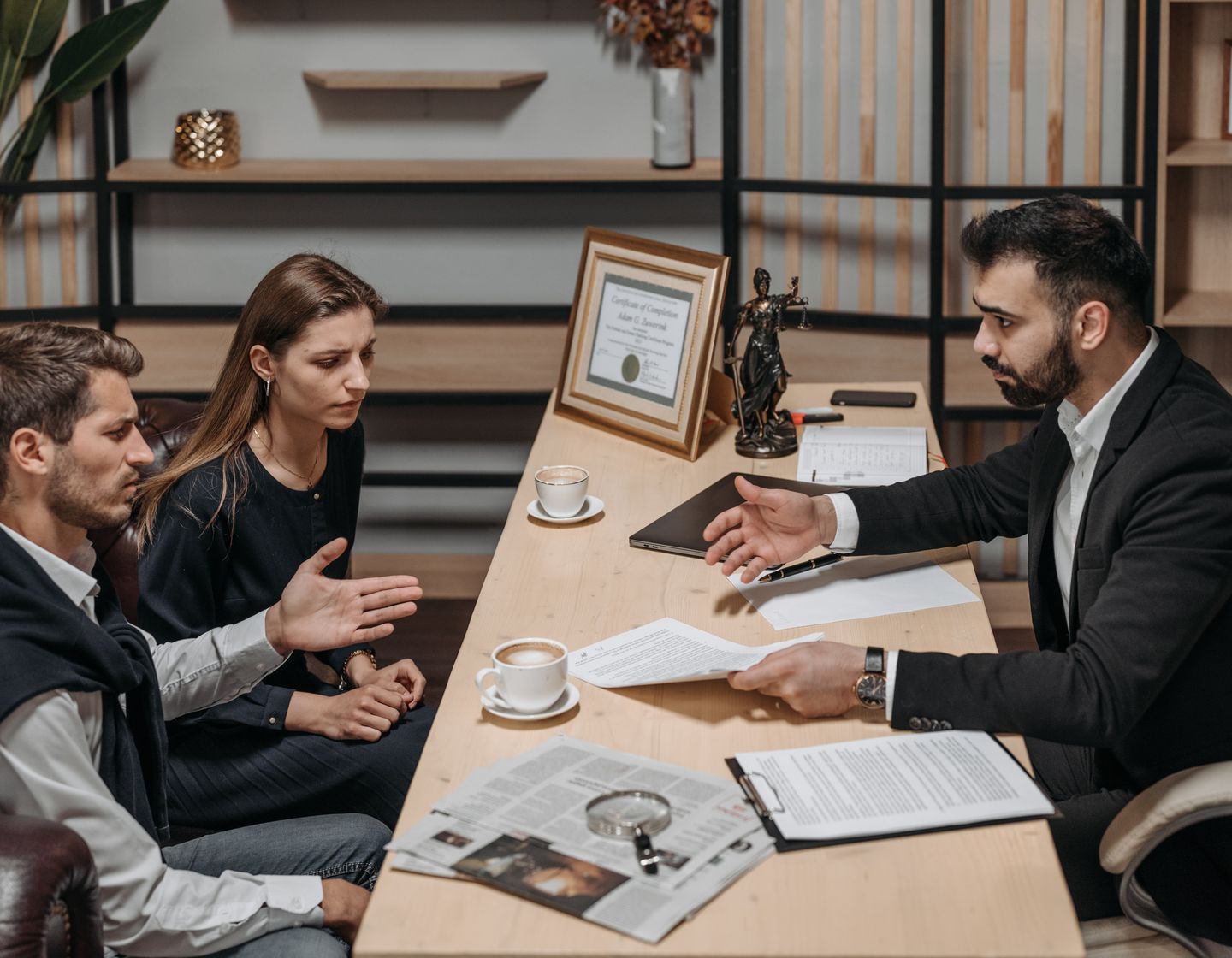 Professionals discussing and reviewing documents together in an office